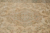 Tone-on-tone floral patterns with powder blue accents on the plush ivory pile of a vintage Tabriz.