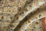 Softly folded vintage Tabriz carpet showing the lush, full pile and detailed scrolling pattern.