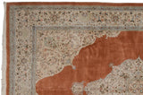 Detail of the vintage Persian Tabriz carpet's corner spandrel, showing scrolling arabesques in ivory and powder blue.