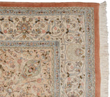 Ornate corner spandrel and powder blue floral border on a vintage Persian Tabriz carpet.