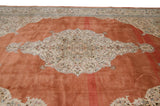 Lush, full pile on the open terracotta-toned field of a vintage Persian Tabriz carpet.