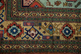 Geometric diamond pattern in red, mint, and navy on vintage Ardebil carpet.