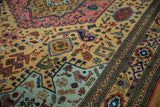 Geometric finned animals, plants, and vibrant green border on a vintage Ardebil rug.