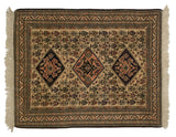 Detail of a vintage Ardebil rug's corner with intricate borders, intact charcoal selvage, and ivory fringe.