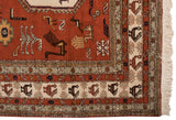 Hand-knotted geometric border with hook motifs and ivory fringe on a vintage Meshkin rug.