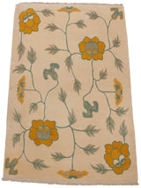 Hand knotted Arts and Crafts rug with saffron yellow flowers, ocean green vines on ivory.
