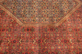 Traditional Herati pattern on a plush vintage Indian Bijar carpet in dusty red and antique ivory.