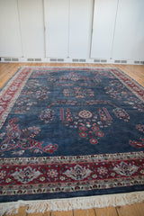 Laristan carpet's ivory fringe and cherry red border with powder blue floral details.