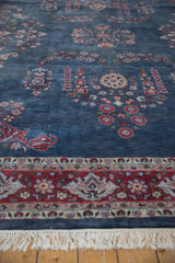 Traditional hand knotted Laristan carpet with cherry red floral border and ivory fringe.