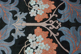 Intricate arts and crafts floral motif with pale denim blue leaves and coral-toned blossoms.