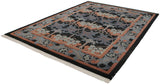Corner view of vintage Indian Arts and Crafts William Morris carpet with black, blue, and coral blossoms.