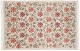Vintage Indian Arts and Crafts carpet with an allover lattice of red and terracotta lotus flowers on an ivory field.