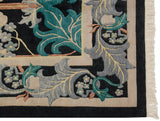 Corner of vintage Indian William Morris carpet with mallard green, silver, ivory floral motif and fringe.