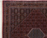 Detailed corner view of vintage Indian Bijar rug, dusty raspberry Herati pattern and slate blue medallion.