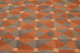Geometric Art Deco pattern with varying textures in copper, pale terracotta, and gray.