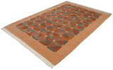 Fringe and corner detail of a vintage Indian Art Deco rug with geometric terracotta, grey pattern.