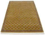 Hand-woven Indian basket weave pattern with carved saffron yellow and beige contour.