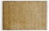 Carved gold and beige interlaced basket weave pattern of a vintage Indian rug.