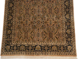 Corner of a vintage Heriz carpet, highlighting the dark navy border against the plush copper field.