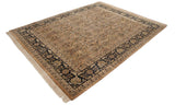 Corner view of a vintage Heriz design rug with a navy floral border and clean ivory fringe.
