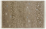 Corner of an Indian folk art rug with ivory fringe and primitive animal figures in art silk.
