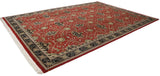 Angled perspective of the oversize William Morris carpet displaying the allover rose and vinery pattern.