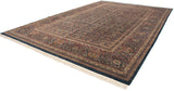Full length perspective of a vintage Indian Doroksh carpet, showing its dense paisley design.