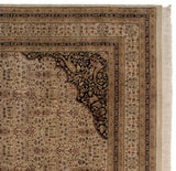 Intricate corner of Indian Tabriz carpet, with black scalloped spandrel and ivory floral field.