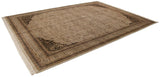 Scalloped corner with intricate black and ivory floral arabesques on this Indian Tabriz rug.