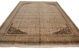 Scalloped corner with black floral arabesques, border, and ivory fringe on Indian Tabriz design carpet.