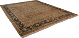 Vintage Indian Heriz carpet with a beige floral field and dark navy border, viewed at an angle.