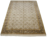 Angled view of a New Agra carpet showing its ivory floral field and detailed Herati border.