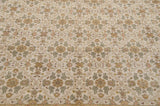 Angled view revealing the intricate floral bouquets and plush, even pile of the hand-knotted Agra carpet.