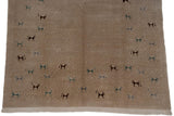 Secure fringe and art silk folk art animals in silver, teal, brown on an Indian carpet.