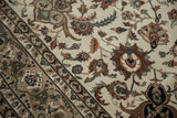 Dense wool pile of an Indian Isfahan carpet with intricate scrolling vinery and serrated leaves.