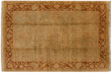 Lustrous gold wash Oushak rug with a tone-on-tone floral field and a dusty rust palmette border.