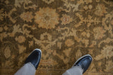 Close-up view of the full, soft pile and gold floral pattern of an Indian Oushak rug.