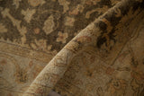 Soft, full pile with a high luster on an Oushak rug in olive green and dusty gold.