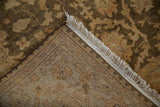 Close-up of the hand-knotted foundation, side cord, and fringe of the Indian Oushak rug.