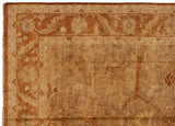 Oushak carpet corner with a rust and copper-toned meandering vine and serrated leaf border.