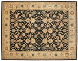 Corner detail of a Sultanabad carpet showing its wheat floral border and black field.