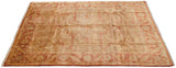 Indian Oushak rug corner, golden olive field with rust Samovar turtle design and vine border.