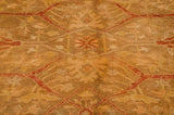 Soft pile of Oushak rug showing golden olive and copper tones, Samovar turtle arabesque motifs.