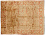 Indian Oushak rug corner with golden-cast field, terra cotta meandering vine and leaf border.