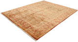 Gleaming gold and copper tones on the Indian Oushak rug's serrated leaf border, with fringe.