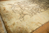 Lustrous charcoal floral field and ivory palmette border of Indian Oushak carpet.