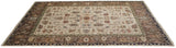 Hand-knotted Serapi carpet showing full pile and intricate vinery in ivory, green, and copper.