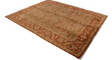High-angle view of a gold wash Oushak carpet with a rust-colored floral palmette border.