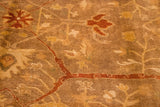 Soft, lustrous pile of an Oushak design carpet with copper and golden olive floral vinery.