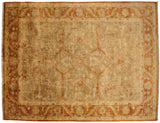 A gold wash Indian Oushak carpet with an allover floral field and meandering palmette main border.
